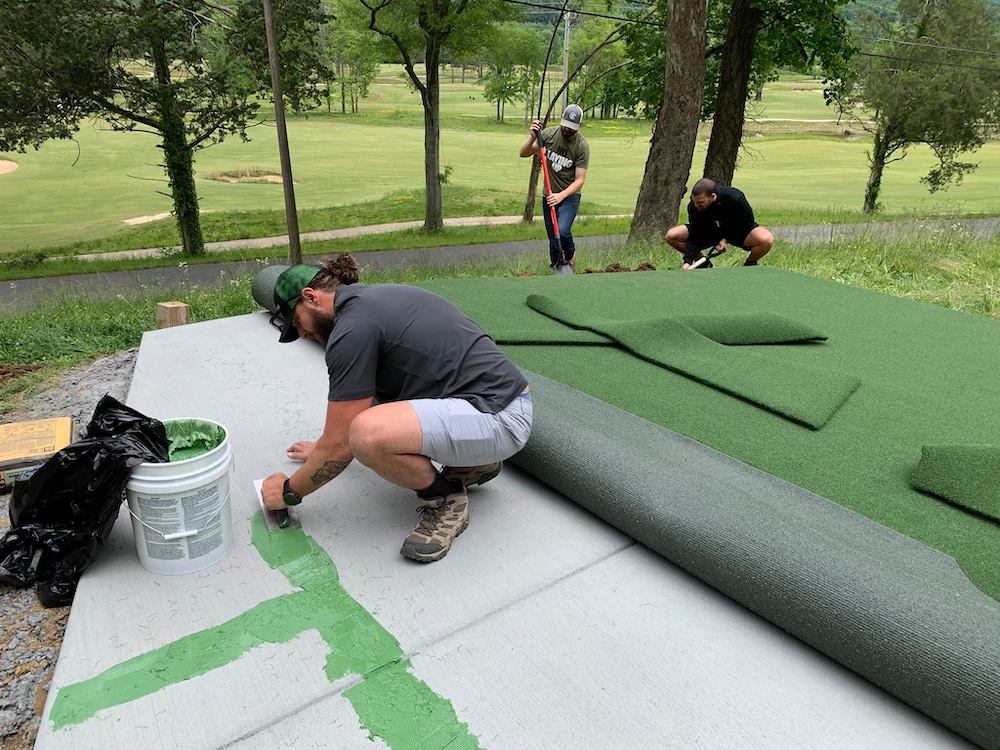 Men installing artificial grass